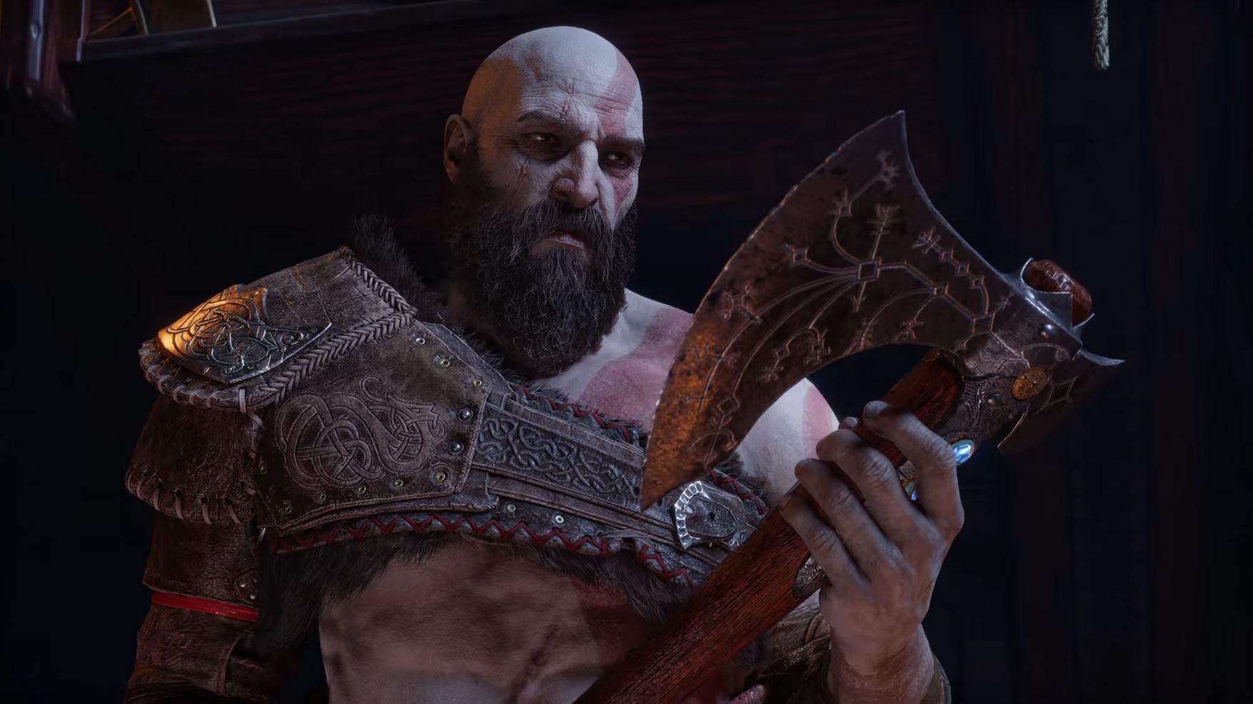 Kratos looks at the Leviathan Axe.