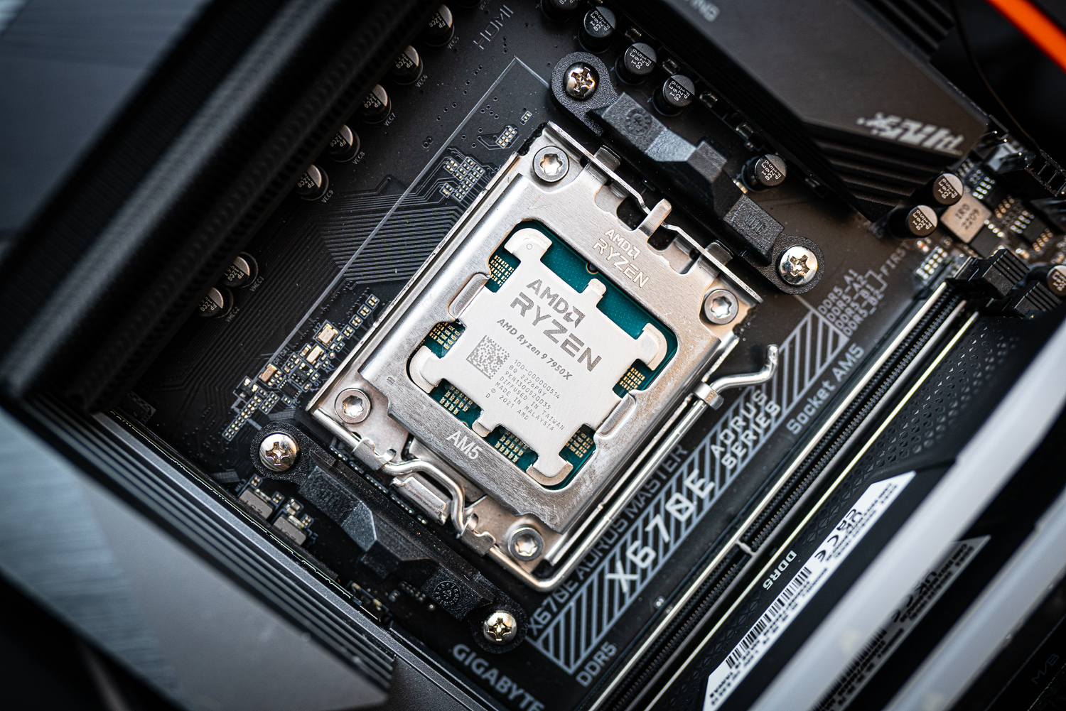 Intel Core i9-13900K held between fingertips