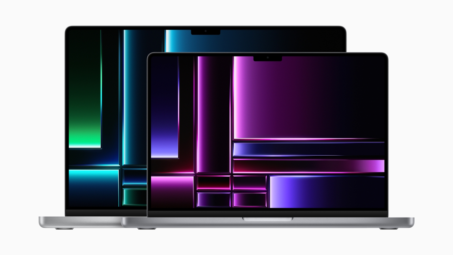 The 14-inch MacBook Pro with M2 chips in front of the 16-inch MacBook Pro with M2 chips.