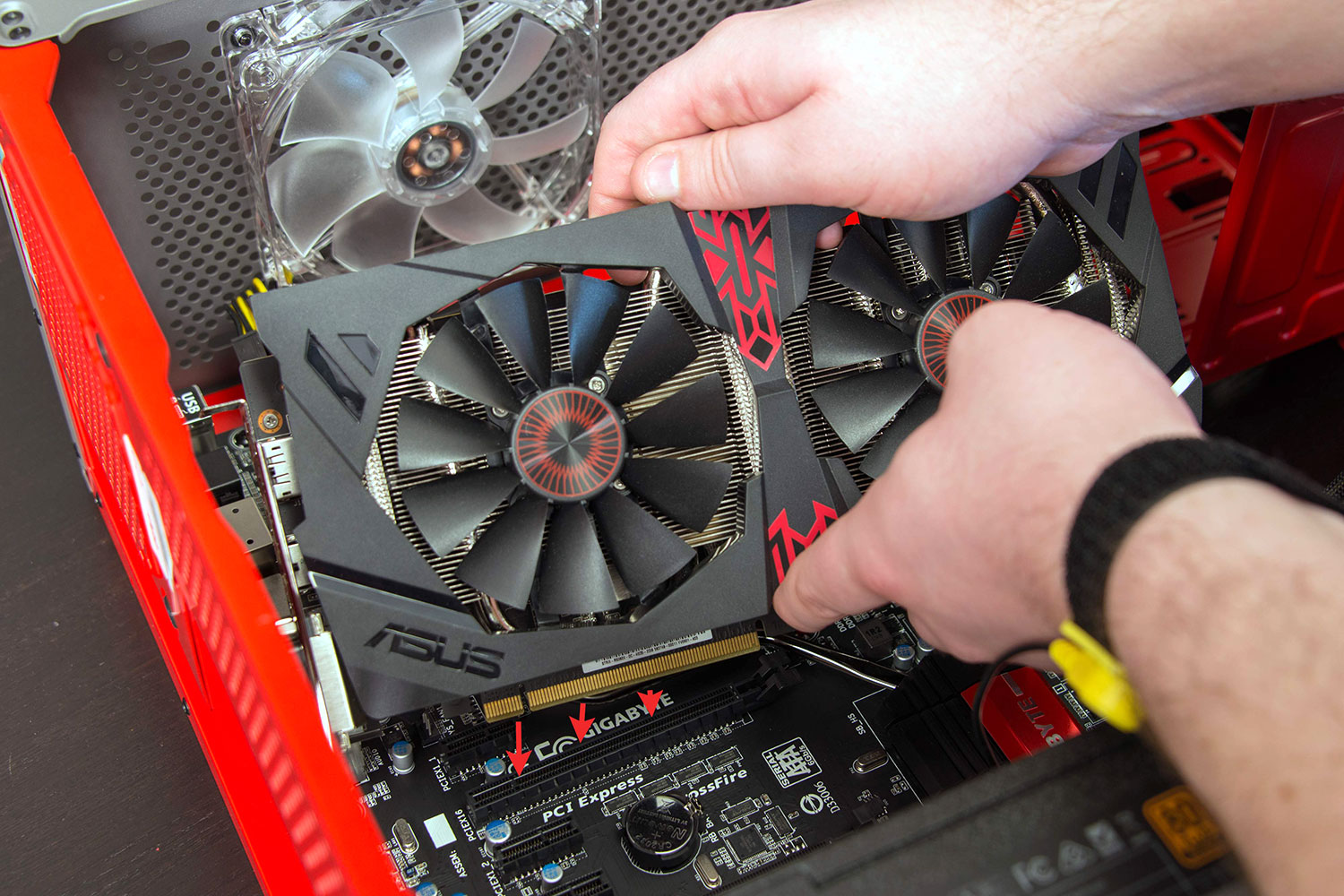 Installing a graphics card into the PCIe slot.