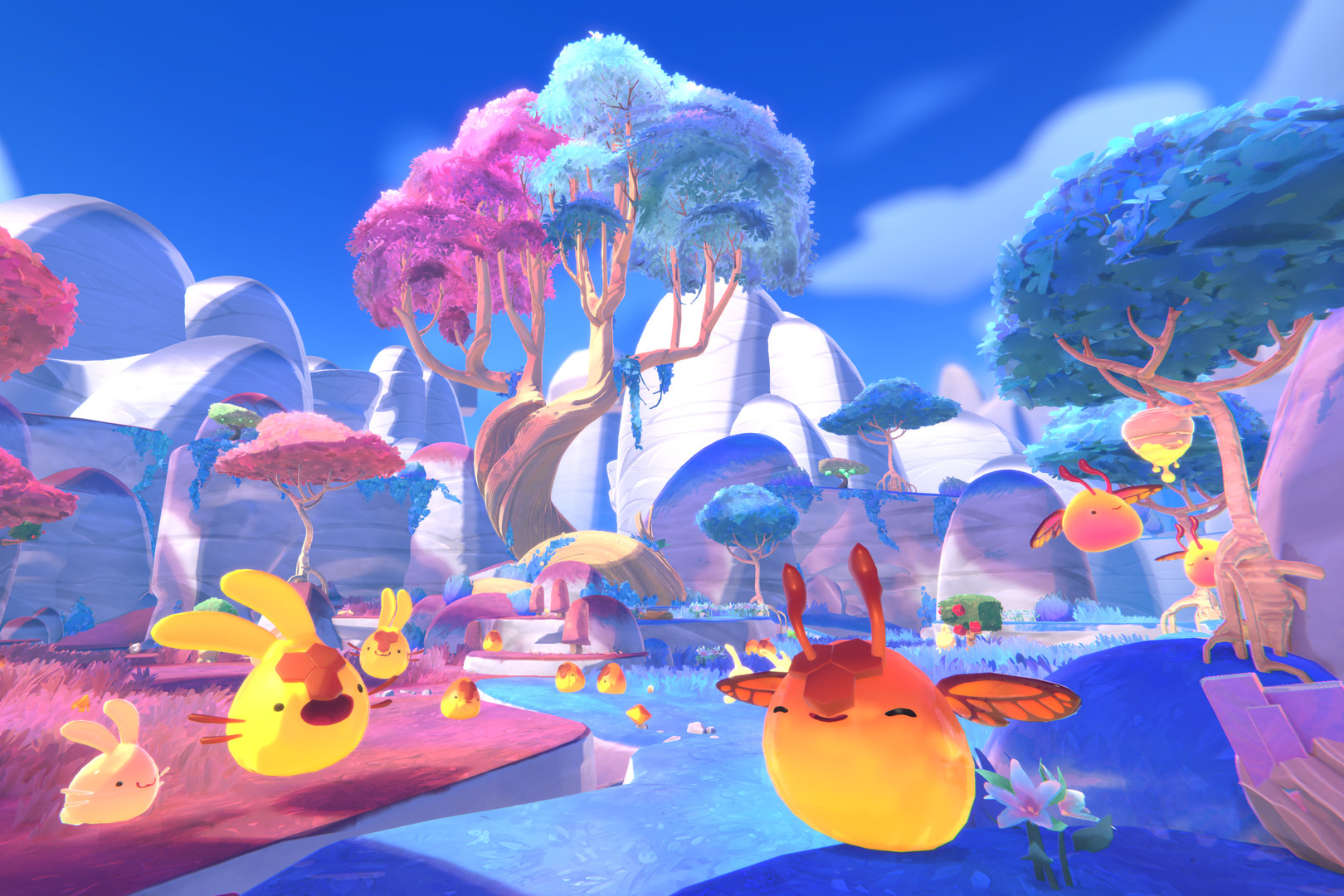 Slimes happily bounce around in the wild in Slime Rancher 2
