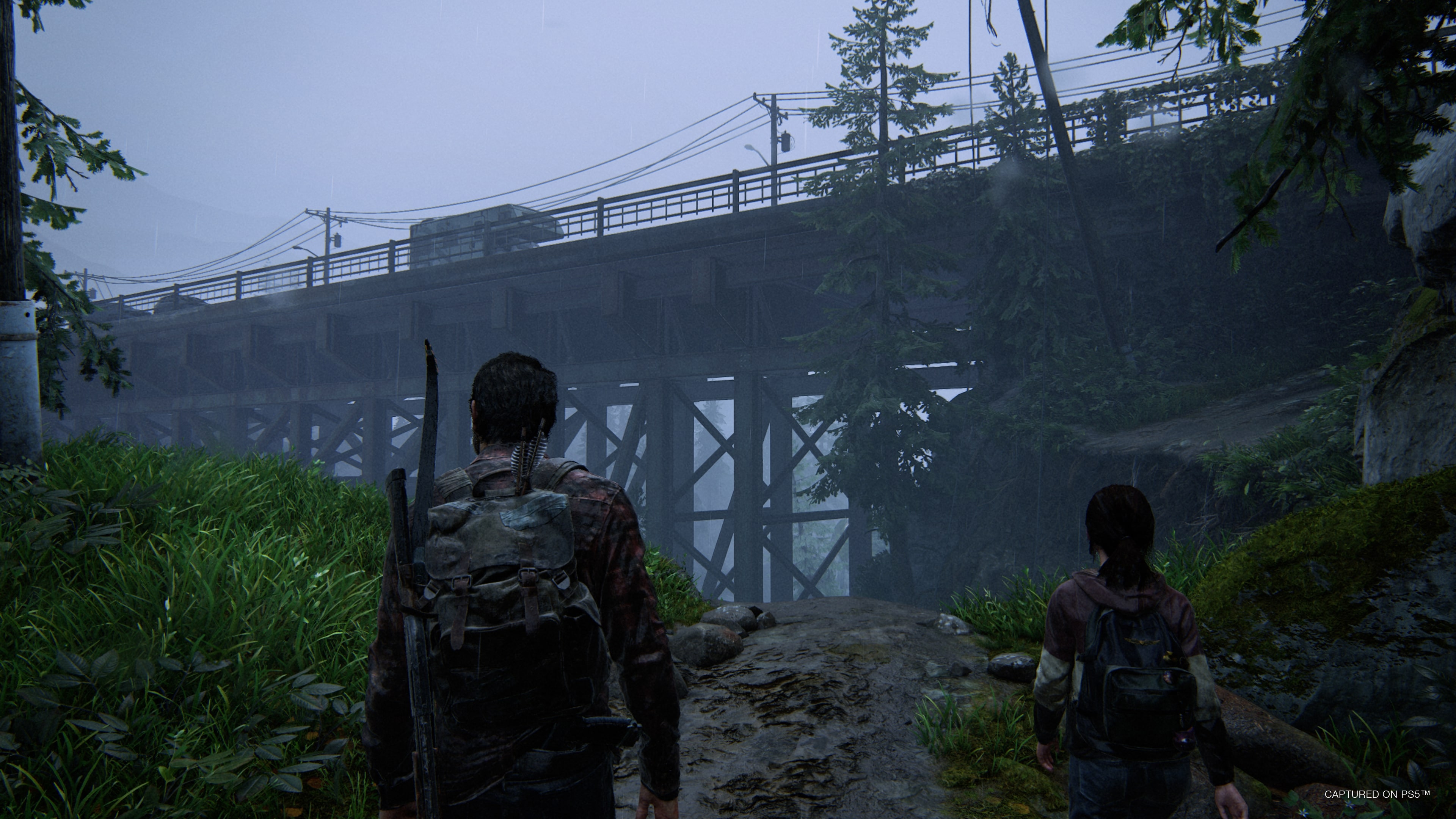 Joel dodges a bloater attack in The Last of Us Part I