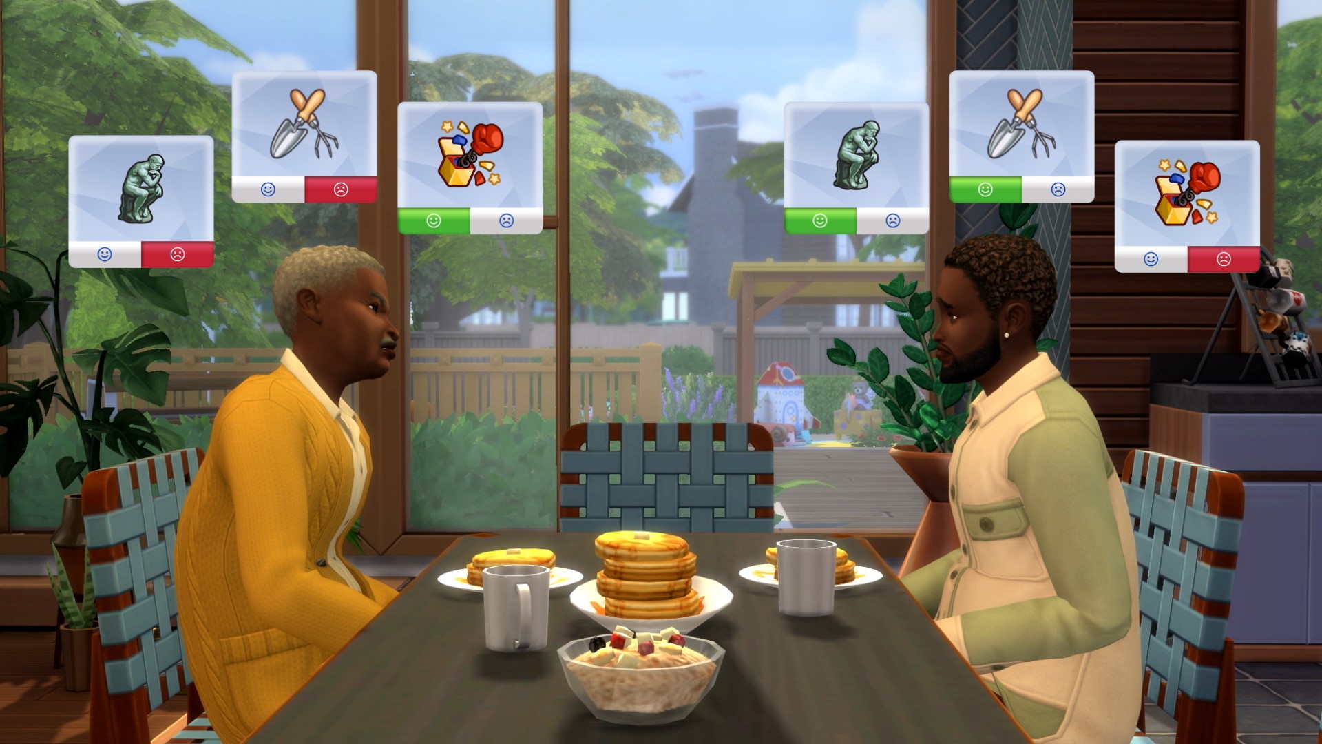 An elder Sim and an adult Sim sit across a dining table from each other. They have different likes and dislikes displayed above their head.