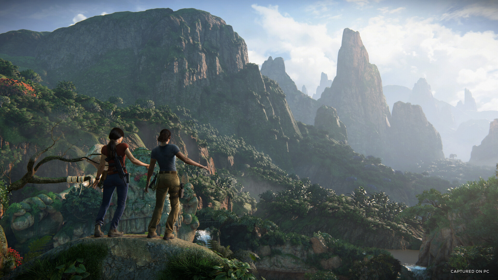 Two characters standing on a mountain in Uncharted: The Lost Legacy.