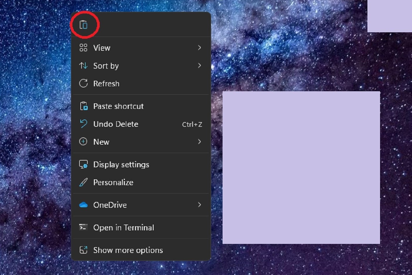 The Paste option icon that appears after right-clicking to paste a copied file onto the desktop in Windows 11.